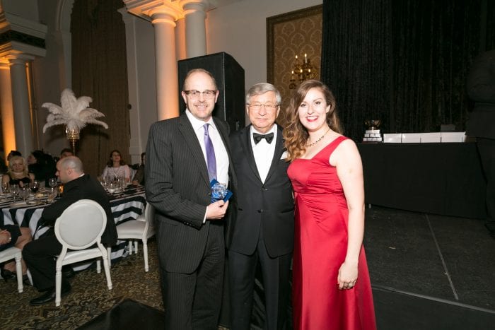 Peter Macdonald, Instructor of Strategic Management/Policy accepting the award with Dean Dezsö J. Horváth and VP of the Graduate Business Council Alisa Bialas
