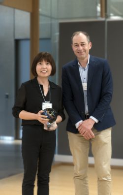 Professor Shao photographed with Dean Zwick after receiving the Research Impact Emerging Leader Award