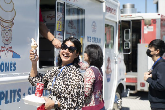 Akansha Jakhar, Recruitment & Communications Coordinator at Schulich, enjoys ice cream from the food trucks at the School’s New2Canada Festival