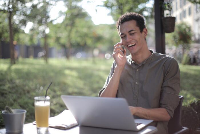 Man working at laptop outdoors