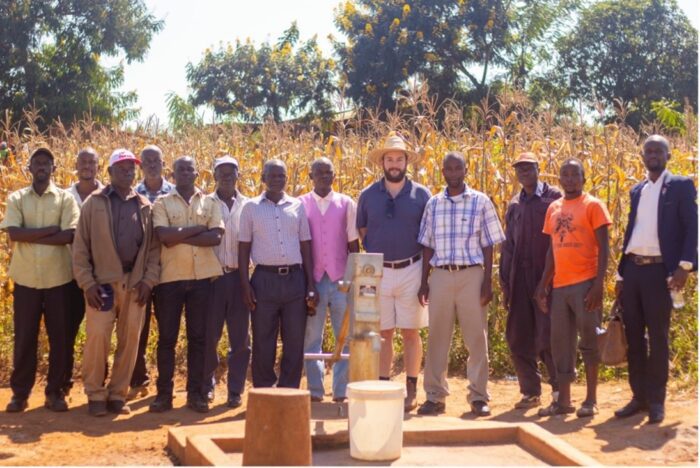 Camenzuli and community members open the Moore Well in Malawi