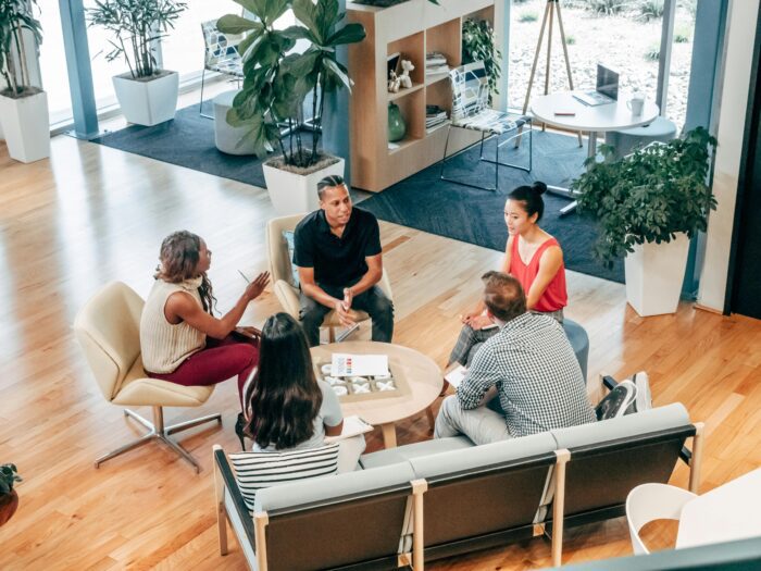 Informal team meeting at workplace with diverse employees