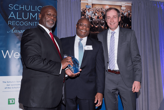 Dennis, recipient of the 2023 Alumni Recognition Award for “Outstanding Executive Leadership” with his brother Mike Mitchell and Dean Detlev Zwick.