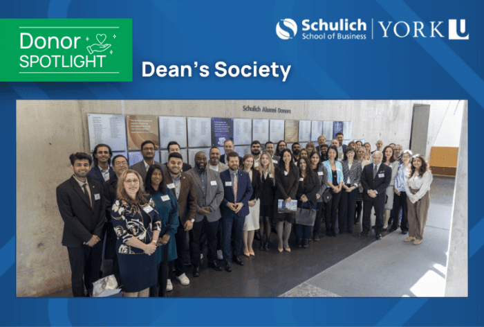 picture of Dean's Society in front of the Donor Wall