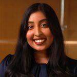 Headshot of Anjelica, a Schulich Alumni, Smiling at the camera